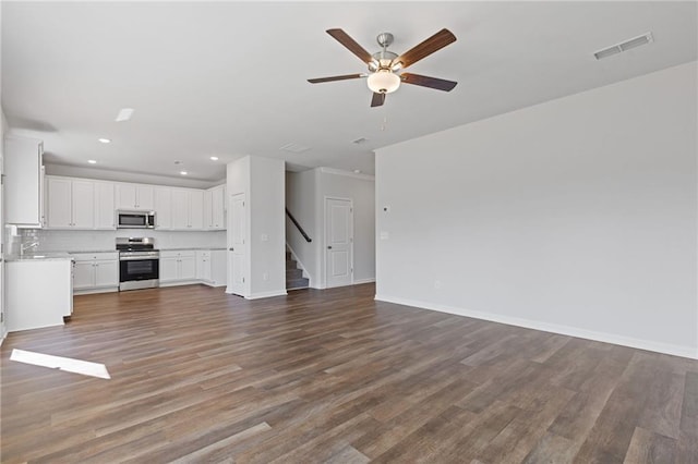 unfurnished living room with recessed lighting, ceiling fan, visible vents, and wood finished floors