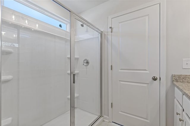 bathroom featuring vanity and a stall shower