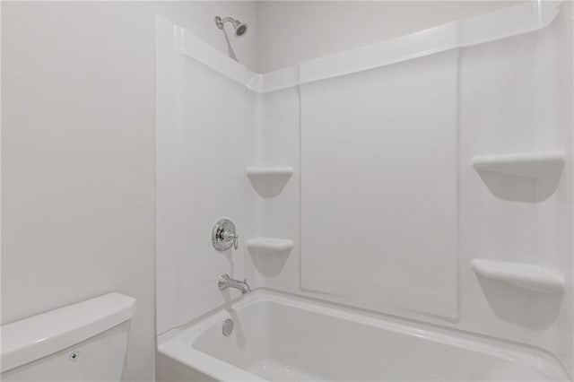 bathroom with toilet and shower / washtub combination