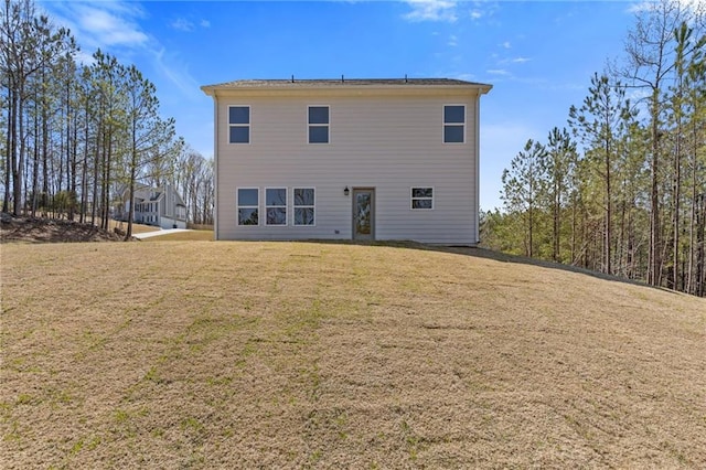back of house featuring a yard