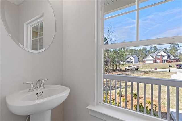 bathroom featuring a sink and a residential view