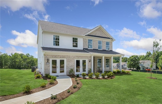 view of front of property with french doors and a front yard