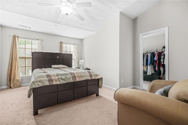 1622 Honeysuckle Path, Conyers, GA 30012 - bedroom featuring a textured ceiling, light colored carpet, a spacious closet, baseboards, and a closet