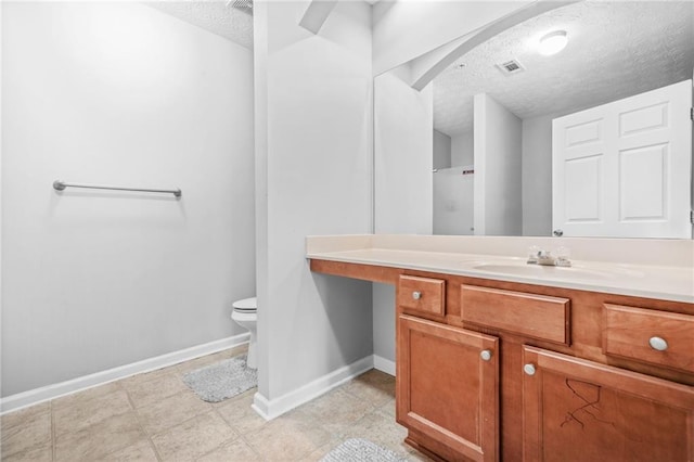 1622 Honeysuckle Path, Conyers, GA 30012 - full bath featuring a textured ceiling, baseboards, toilet, vanity, and a shower