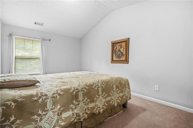 1622 Honeysuckle Path, Conyers, GA 30012 - carpeted bedroom featuring vaulted ceiling, baseboards, and a textured ceiling