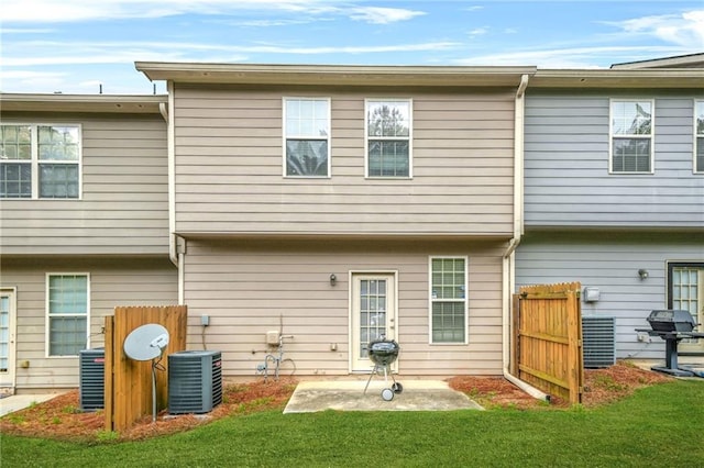 1622 Honeysuckle Path, Conyers, GA 30012 - rear view of house with a patio and central air condition unit