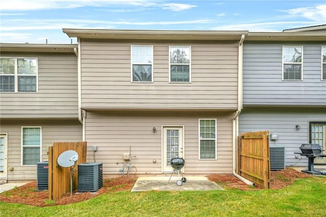 1622 Honeysuckle Path, Conyers, GA 30012 - back of house with a patio and cooling unit