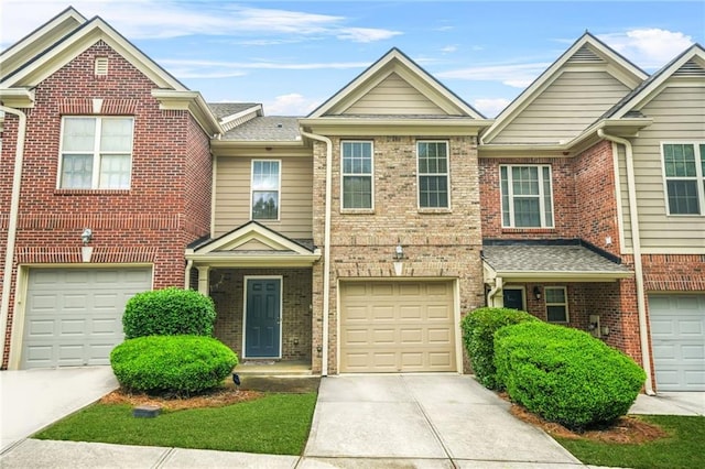 1622 Honeysuckle Path, Conyers, GA 30012 - townhome / multi-family property featuring driveway, brick siding, and an attached garage