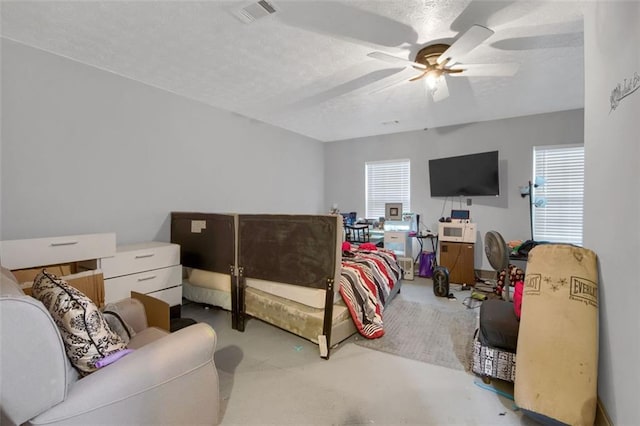 652 Post Oak Rd, Jonesboro, GA 30238 - bedroom with multiple windows, a textured ceiling, and ceiling fan
