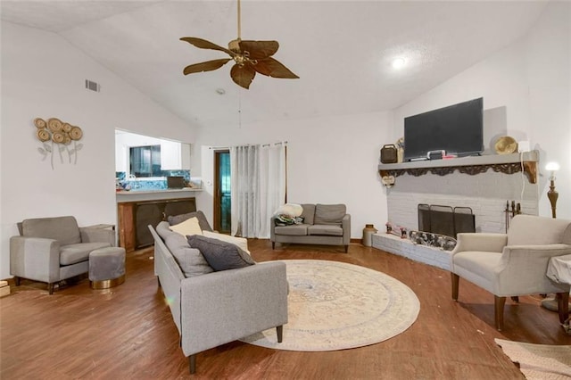652 Post Oak Rd, Jonesboro, GA 30238 - living area featuring ceiling fan, wood finished floors, a fireplace, and high vaulted ceiling