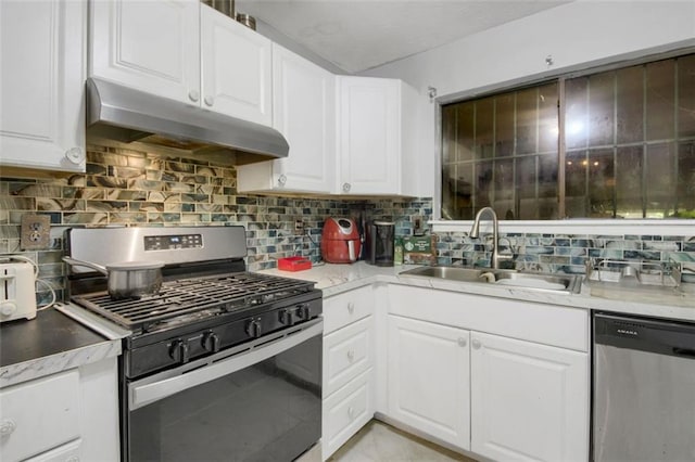 652 Post Oak Rd, Jonesboro, GA 30238 - kitchen featuring stainless steel appliances, under cabinet range hood, white cabinets, backsplash, and light countertops
