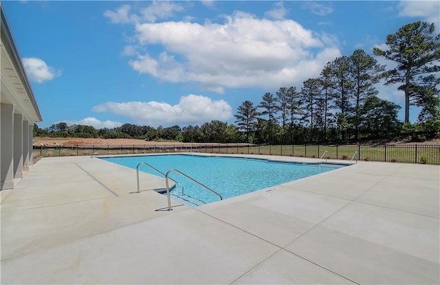 view of pool featuring a patio