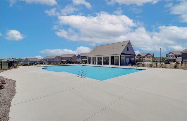 view of swimming pool with a patio