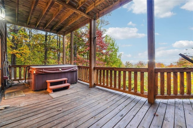 deck featuring a hot tub