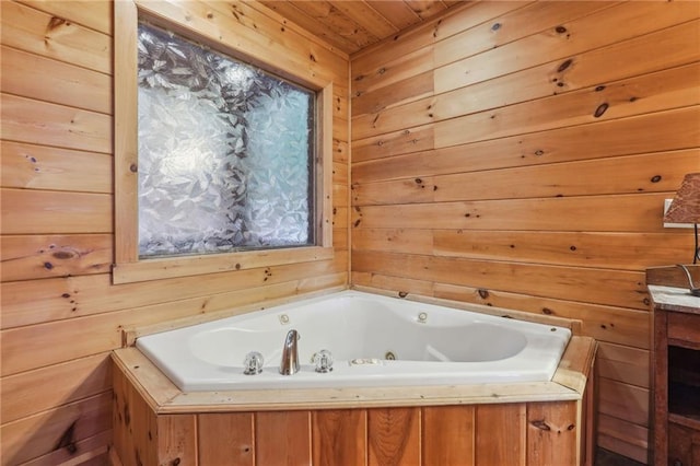 bathroom with wood ceiling, a bathing tub, and wooden walls