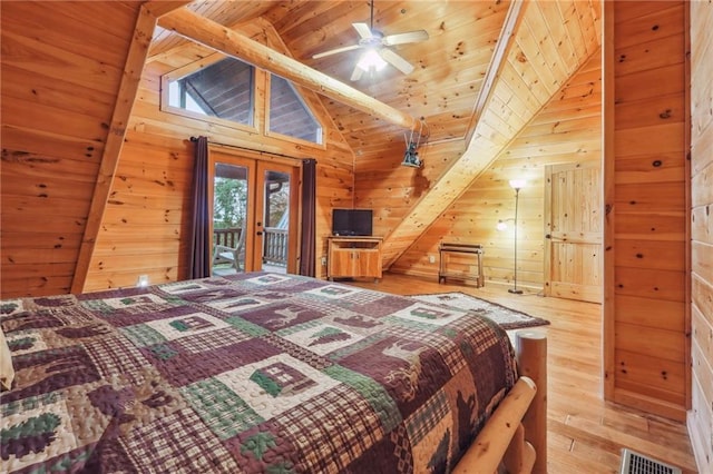 bedroom with wood ceiling, light hardwood / wood-style flooring, lofted ceiling with beams, and french doors