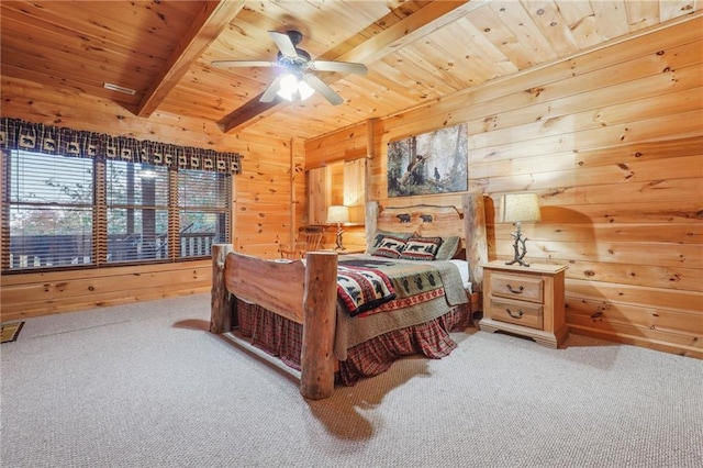 bedroom with light colored carpet, wood walls, ceiling fan, beamed ceiling, and wood ceiling