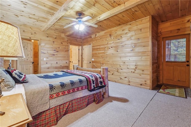 bedroom featuring wood ceiling, beam ceiling, carpet, and wooden walls