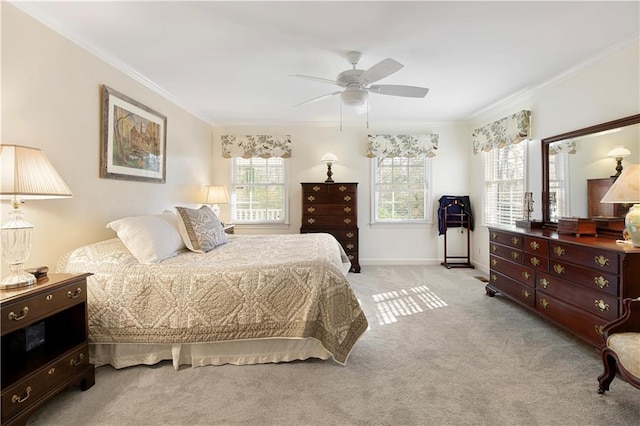 bedroom featuring multiple windows, crown molding, light colored carpet, and ceiling fan