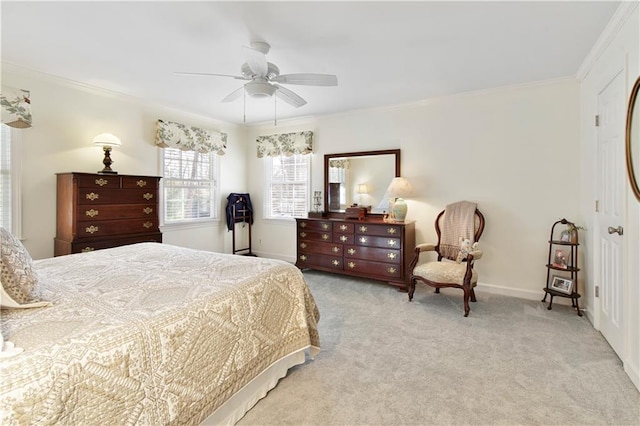 bedroom featuring ceiling fan, ornamental molding, and light carpet