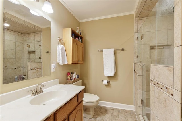 bathroom featuring vanity, crown molding, a shower with shower door, and toilet