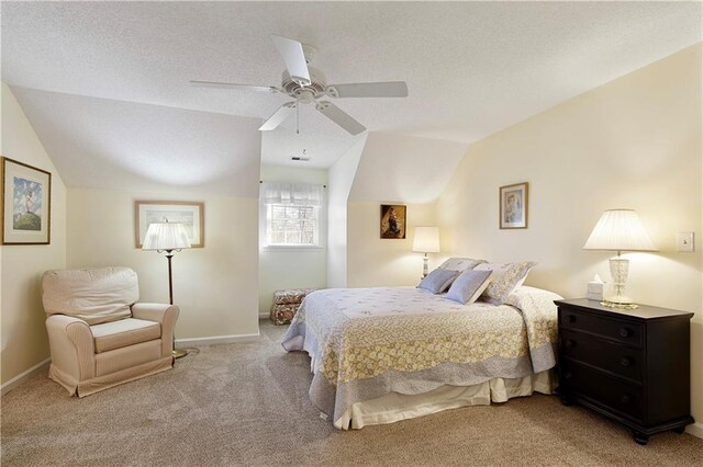 carpeted bedroom featuring vaulted ceiling and ceiling fan