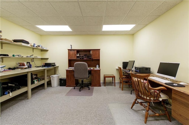 office featuring a paneled ceiling and light colored carpet