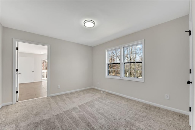 spare room with light colored carpet