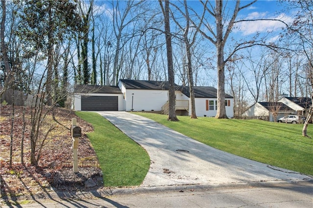 ranch-style home with a front yard and a garage