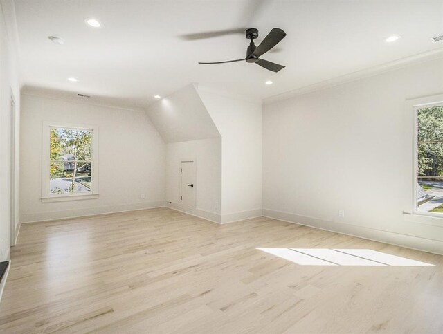 bonus room featuring ceiling fan, light hardwood / wood-style flooring, and a wealth of natural light