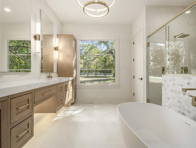 bathroom with vanity, separate shower and tub, and tile patterned flooring