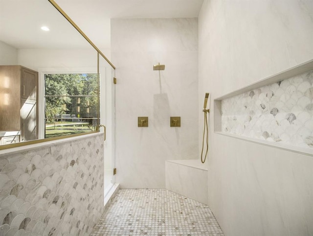 bathroom with a shower and tile patterned floors