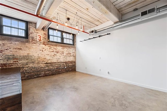 basement with brick wall