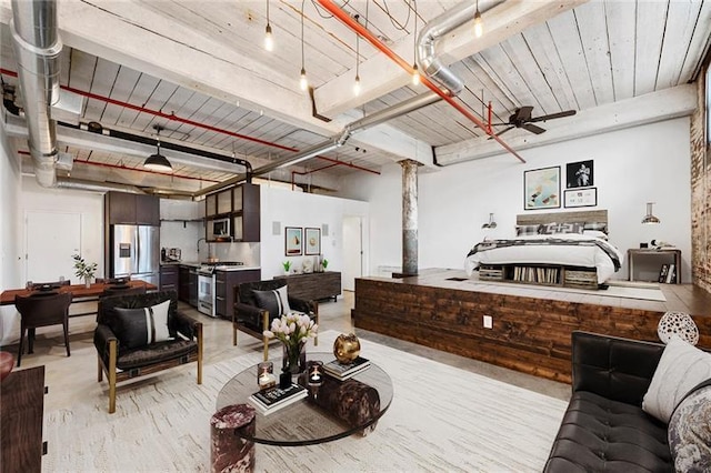 interior space with ceiling fan, stainless steel fridge, and wooden ceiling