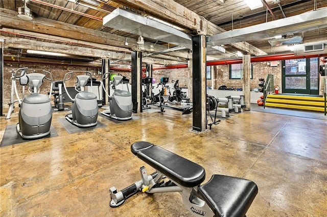 workout area with brick wall