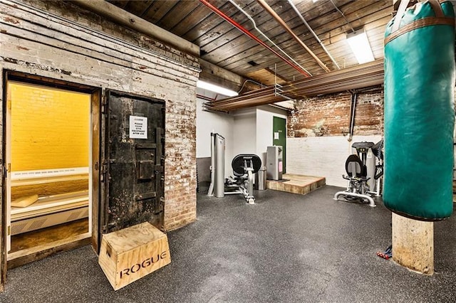 exercise room with brick wall