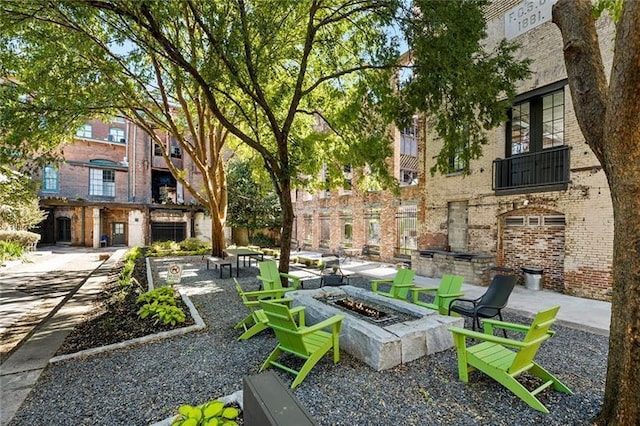 exterior space featuring a fire pit and a patio