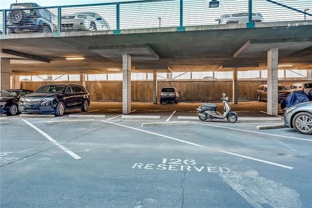 view of parking / parking lot featuring a carport