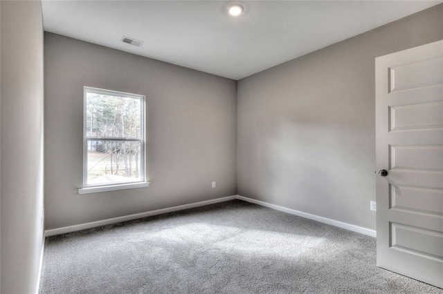 spare room with carpet floors and baseboards