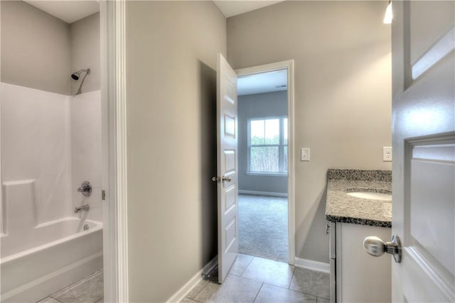 full bathroom featuring vanity, shower / tub combination, baseboards, and tile patterned flooring