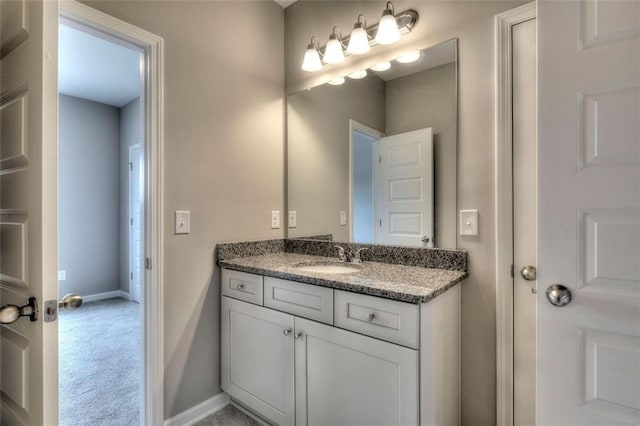 bathroom featuring vanity and baseboards