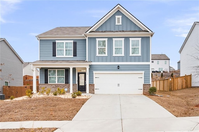 craftsman-style home with cooling unit and a garage