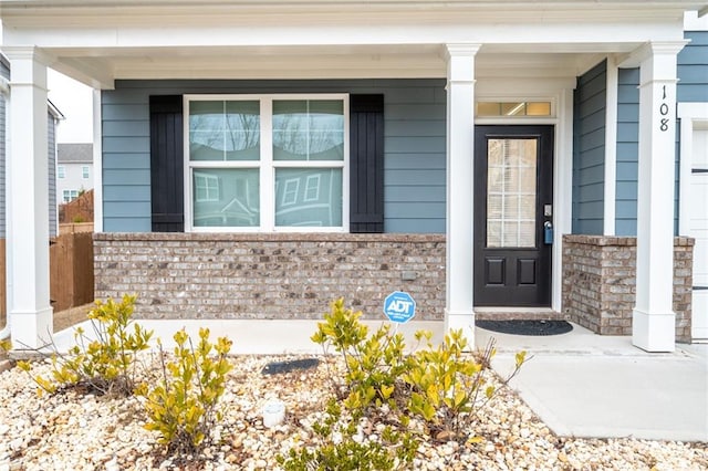 doorway to property featuring a porch