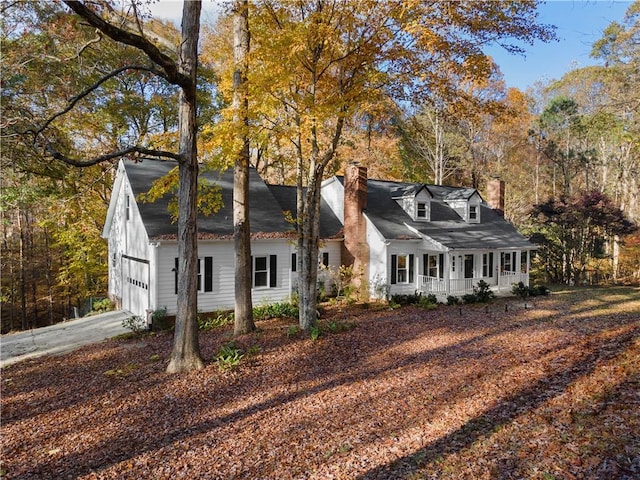 cape cod home with a porch