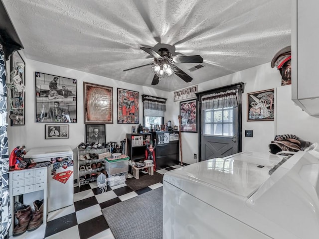 office with ceiling fan, washer / dryer, and a textured ceiling