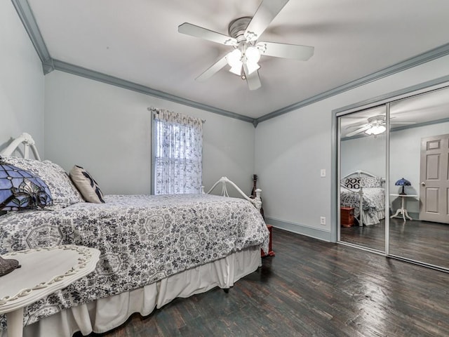 bedroom featuring crown molding, ceiling fan, dark hardwood / wood-style flooring, and a closet