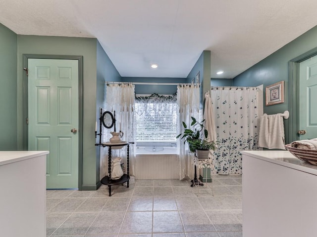 bathroom featuring tile patterned flooring and shower with separate bathtub