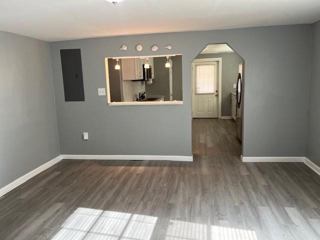 interior space featuring electric panel and hardwood / wood-style flooring