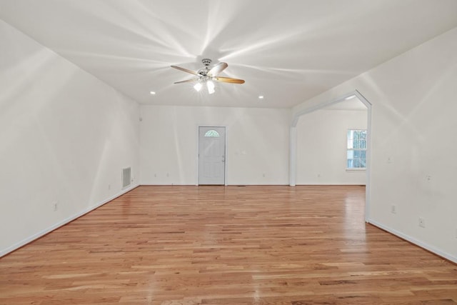 spare room with light hardwood / wood-style floors and ceiling fan