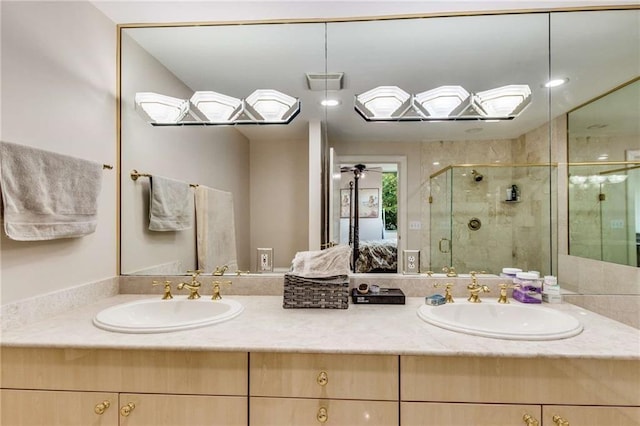 bathroom featuring vanity, walk in shower, and ceiling fan